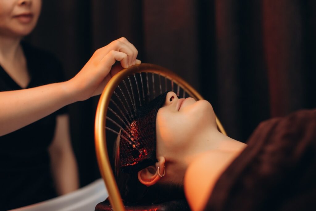 Woman relaxing during a Japanese head spa water treatment
