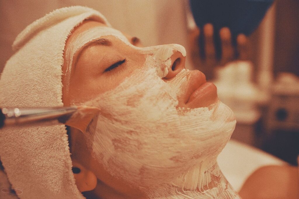 Relaxed client with fresh, glowing skin during a facial treatment